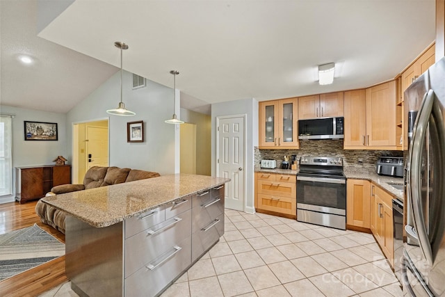 kitchen with tasteful backsplash, visible vents, glass insert cabinets, appliances with stainless steel finishes, and light stone countertops