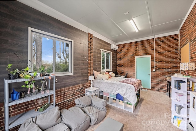 carpeted bedroom featuring crown molding, brick wall, and a wall mounted AC