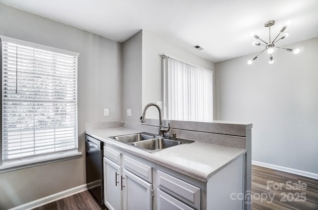 kitchen with dishwasher, a sink, visible vents, and a healthy amount of sunlight