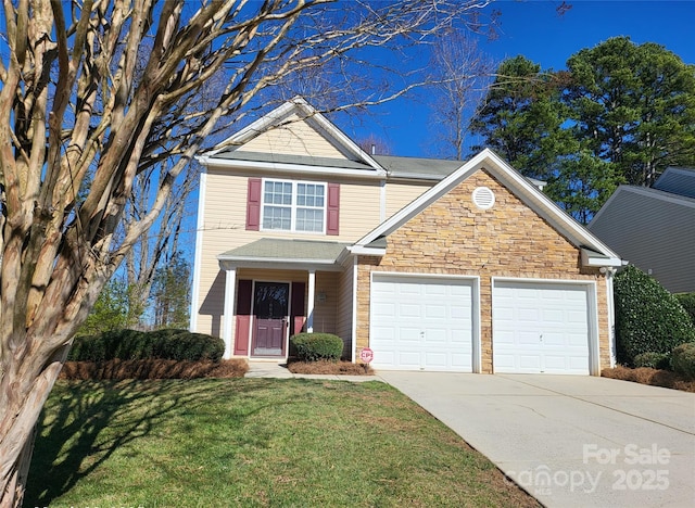 traditional home with stone siding, a garage, driveway, and a front lawn