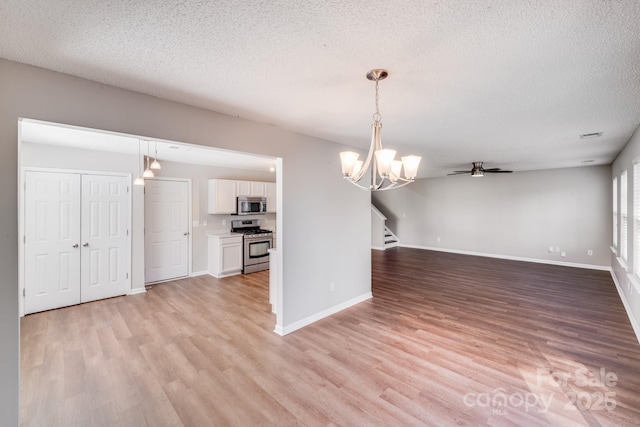 unfurnished dining area with stairway, baseboards, and light wood-type flooring