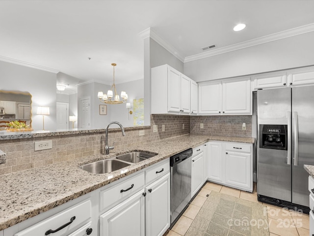 kitchen featuring visible vents, decorative backsplash, appliances with stainless steel finishes, white cabinetry, and a sink