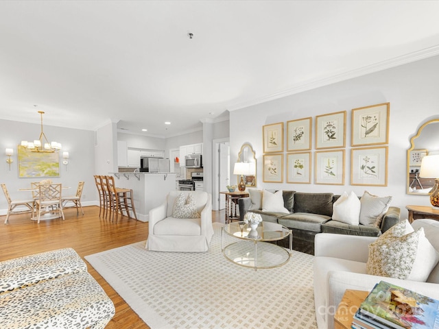 living area with crown molding, light wood finished floors, recessed lighting, a chandelier, and baseboards