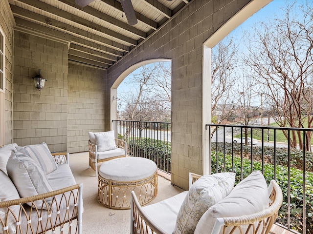 balcony with an outdoor hangout area and a ceiling fan