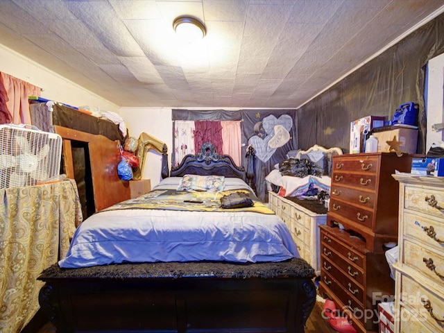 bedroom featuring wood walls