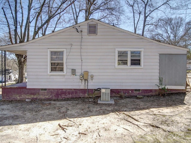 view of side of home with crawl space