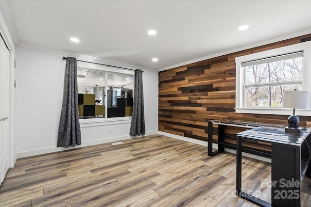 home office featuring ornamental molding, recessed lighting, wooden walls, and wood finished floors