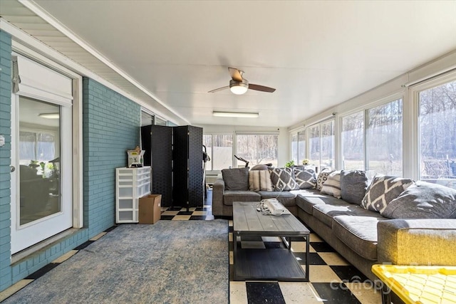 sunroom / solarium with ceiling fan