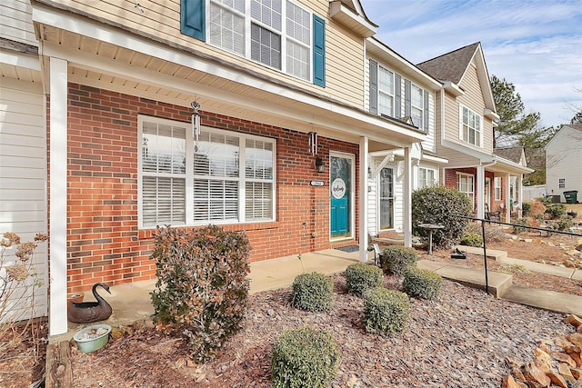 view of front of home featuring brick siding