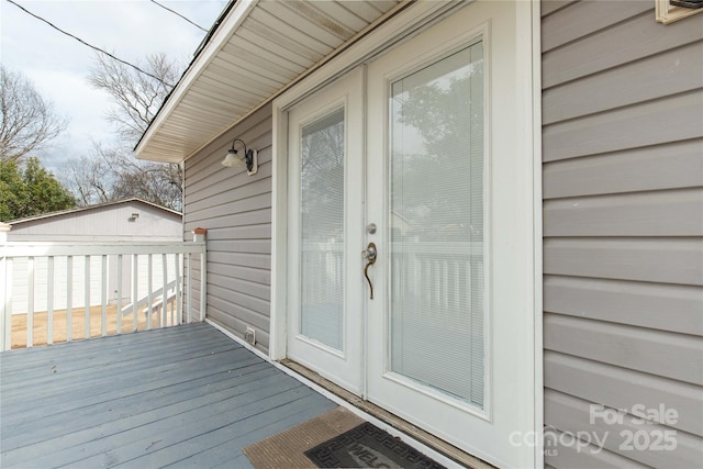 entrance to property with a deck