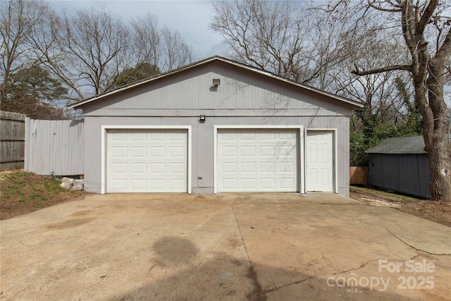 detached garage with fence