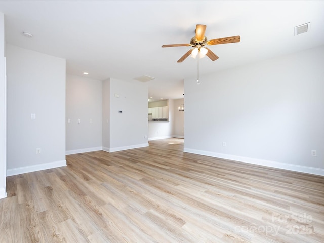 empty room with recessed lighting, a ceiling fan, visible vents, baseboards, and light wood-type flooring