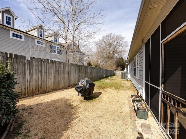 view of yard featuring a fenced backyard and cooling unit