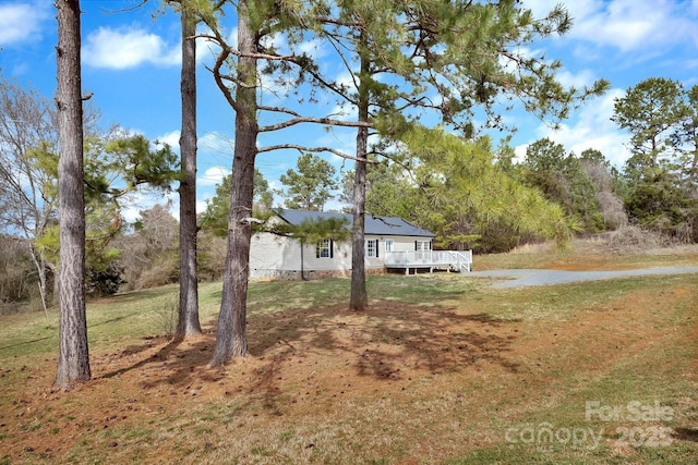 view of yard with a wooden deck