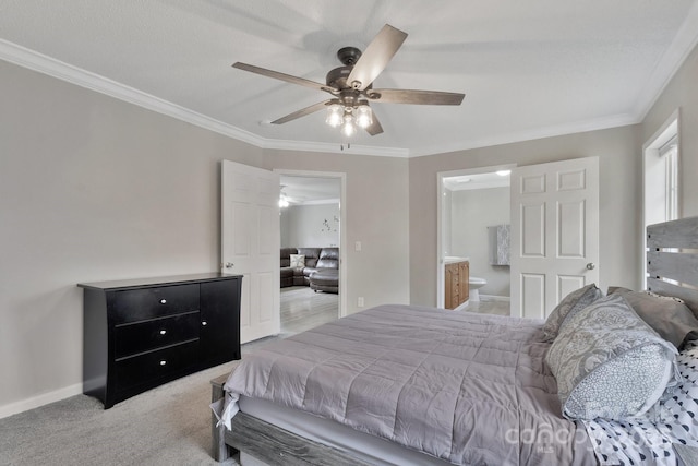 bedroom featuring carpet, crown molding, connected bathroom, ceiling fan, and baseboards