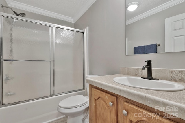 bathroom featuring toilet, shower / bath combination with glass door, ornamental molding, and a textured ceiling