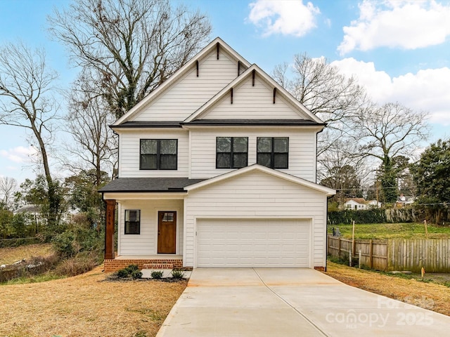 view of front of home with driveway, a garage, a shingled roof, covered porch, and fence