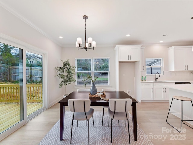 dining room with a wealth of natural light and light wood finished floors