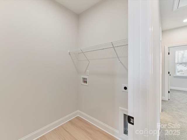 laundry area featuring baseboards, laundry area, electric dryer hookup, and hookup for a washing machine