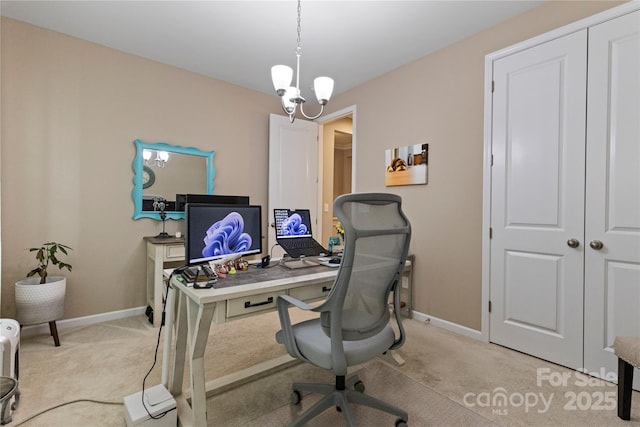 office area with light colored carpet, baseboards, and a chandelier