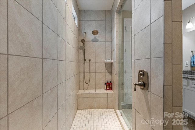 bathroom featuring a stall shower and vanity