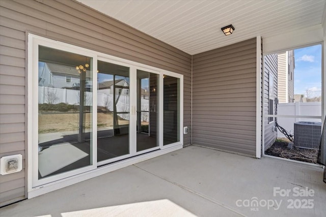 view of patio / terrace with fence and central AC unit