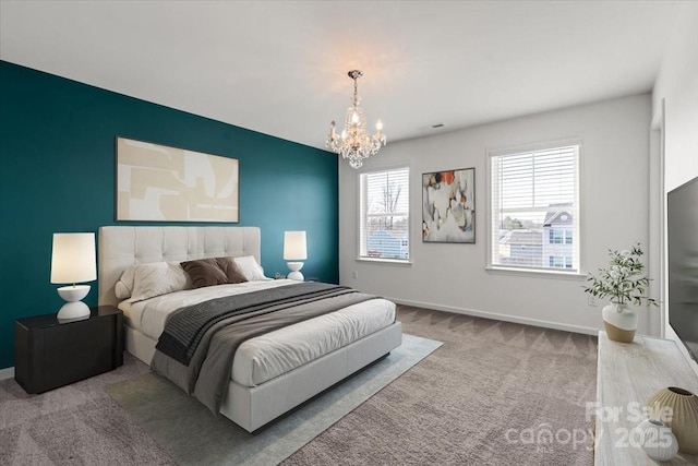 carpeted bedroom featuring baseboards, a chandelier, and visible vents