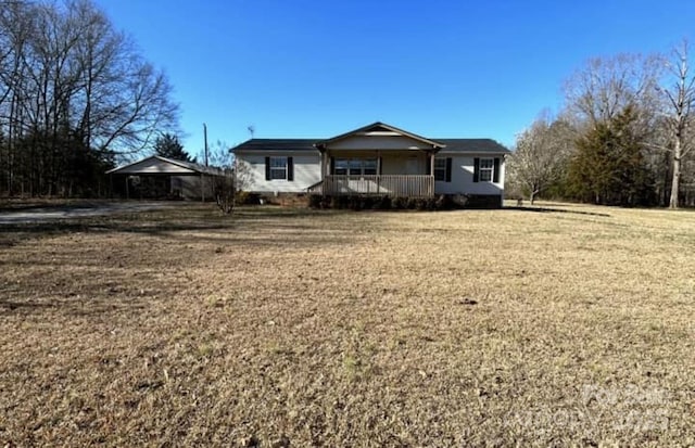 single story home with covered porch and a front yard