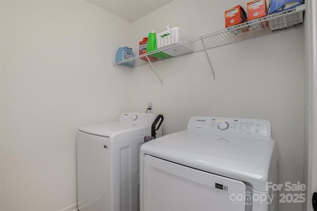 laundry room featuring laundry area and washing machine and clothes dryer