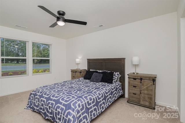 bedroom with carpet floors, baseboards, visible vents, and ceiling fan