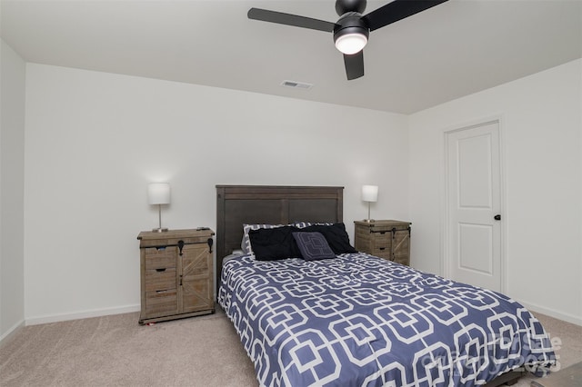 bedroom with baseboards, visible vents, ceiling fan, and carpet flooring