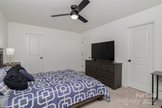 carpeted bedroom featuring ceiling fan