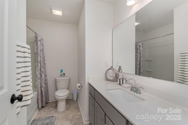 bathroom with shower / bath combo, vanity, toilet, and baseboards