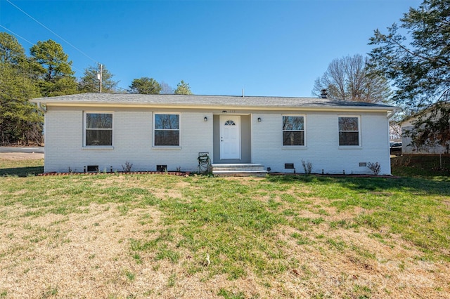 ranch-style house with crawl space, brick siding, and a front lawn