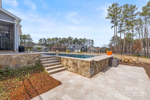 view of pool with a patio, fence, and a fenced in pool