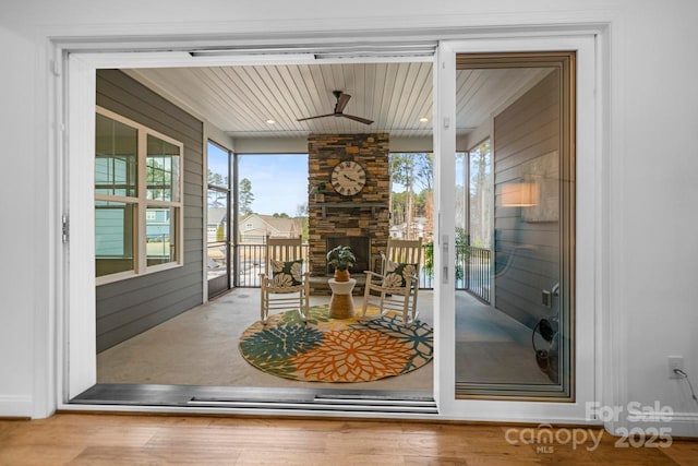 interior space with wood finished floors and ceiling fan