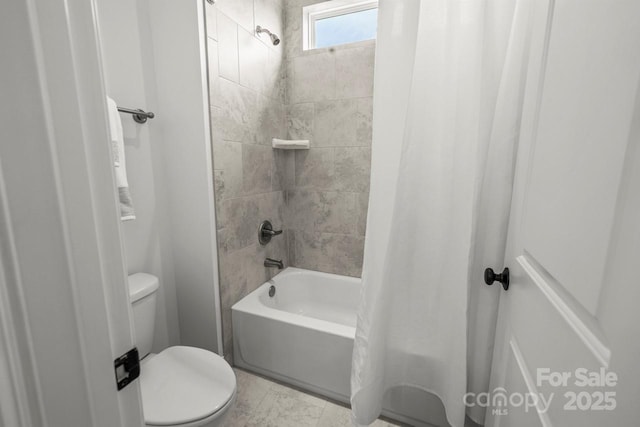 full bath featuring shower / bath combo with shower curtain and toilet