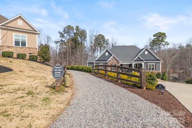 view of road featuring gravel driveway