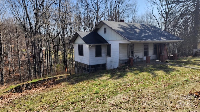 exterior space featuring a porch and a front yard