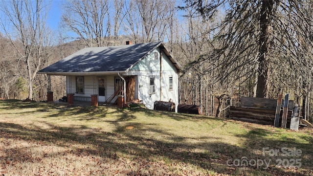 view of outbuilding featuring covered porch