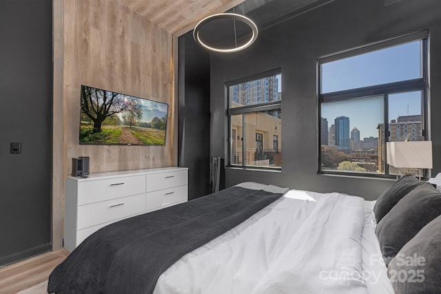 bedroom with light wood-type flooring