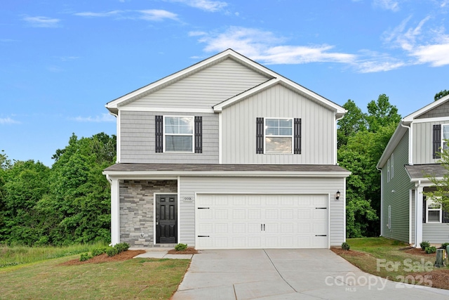 traditional home with a garage, concrete driveway, board and batten siding, and stone siding