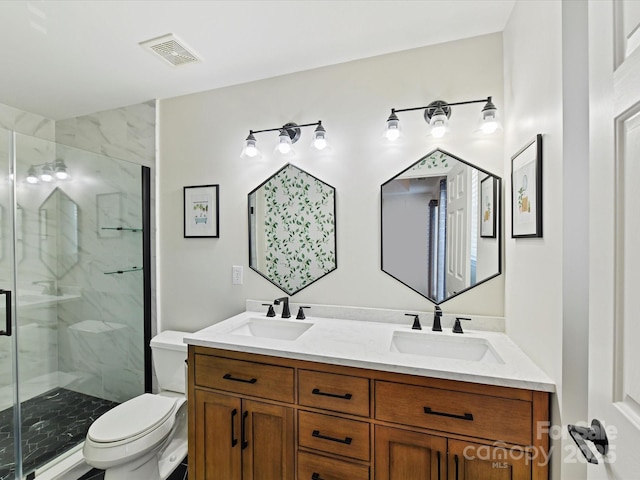 bathroom with a stall shower, visible vents, a sink, and toilet