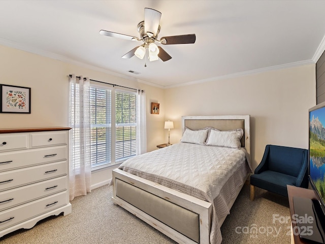 bedroom with crown molding, light colored carpet, visible vents, ceiling fan, and baseboards