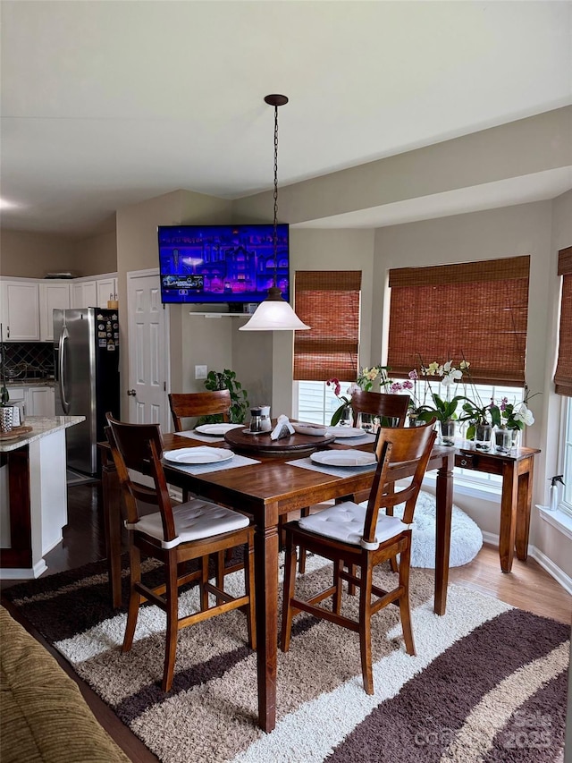 dining room with light wood-style flooring