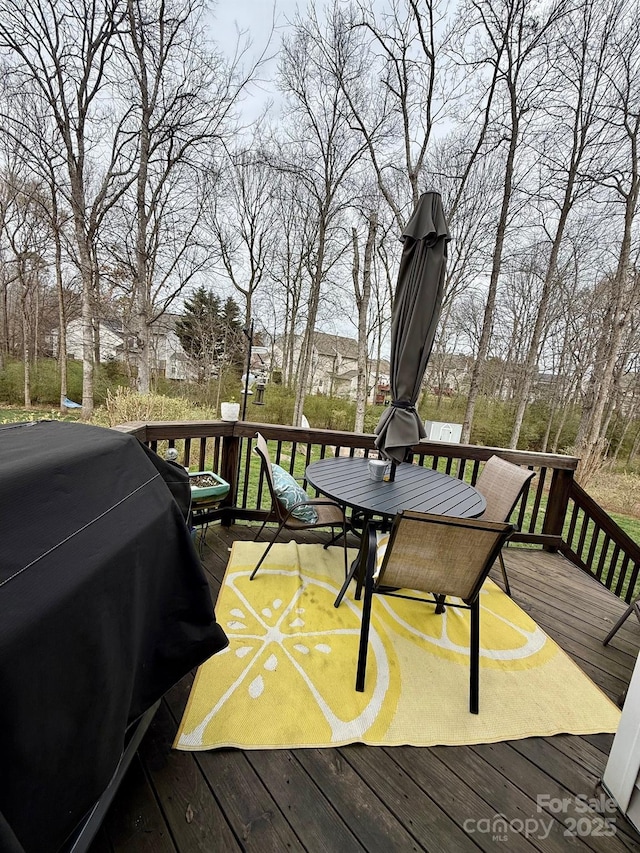 wooden deck with grilling area