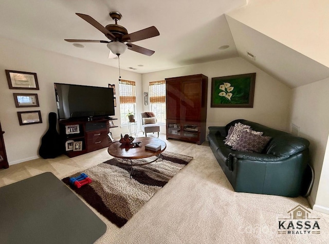 living area featuring light colored carpet, baseboards, lofted ceiling, and ceiling fan