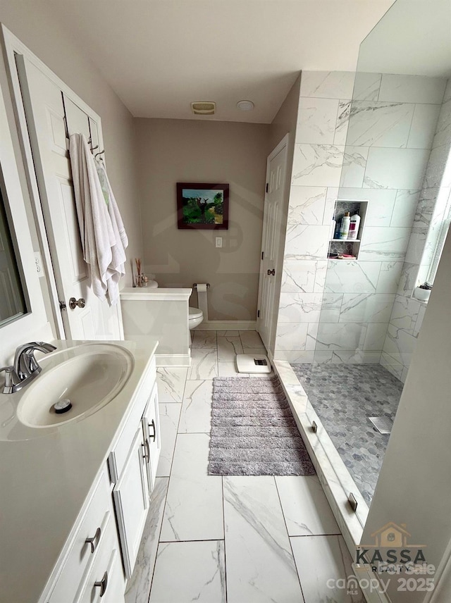 full bath featuring vanity, baseboards, a walk in shower, toilet, and marble finish floor