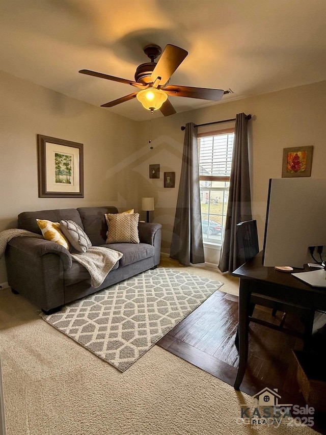 living area featuring ceiling fan