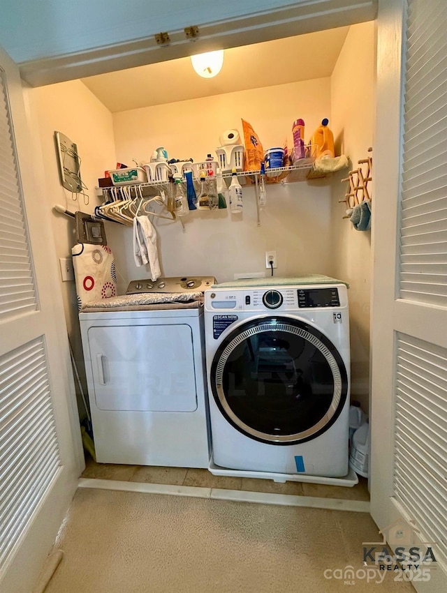 washroom featuring laundry area and washer and clothes dryer